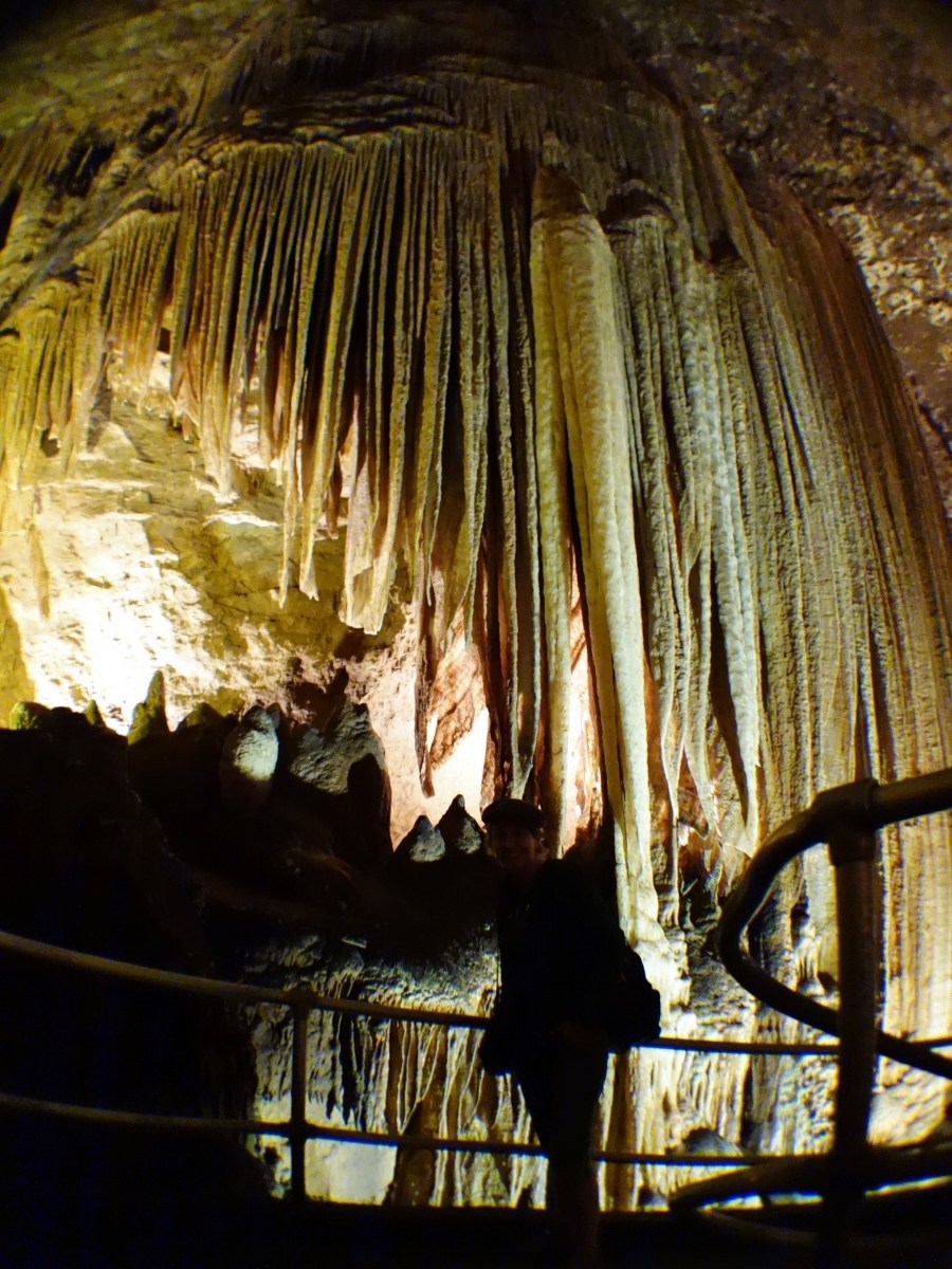 Enormous stalactites descend above April, Blanchard Springs Cavern, Arkansas - Karina Noriega