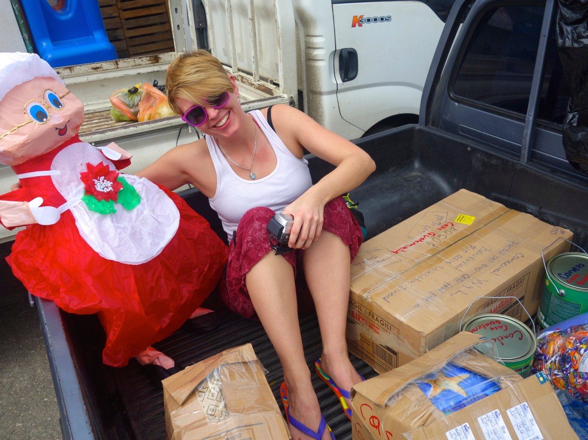 Riding in the back of truck with all the new supplies - Karina Noriega