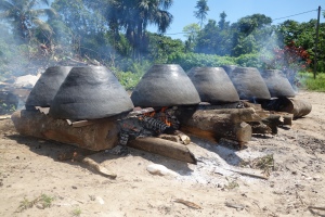 Clay pots cook over a fire. Made by the Amerindians of the Amazon, Suriname -- Karina Noriega