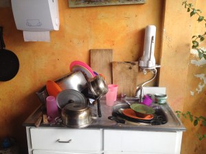 Messy Hostel Kitchen- Unfortunately when you are staying in a hostel, some patrons fail to clean up after themselves. Maid staff will clean up the mess when it bottlenecks but I encourage you to be a respectful traveler and clean up your own mess. Antigua, Guatemala -- April Beresford