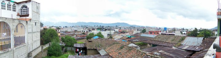 My bedroom in Xela was a concrete addition added on to the rooftop of the family home. When I stepped outside of my bedroom, this was the view overlooking the city. Xela, Guatemala -- April Beresford