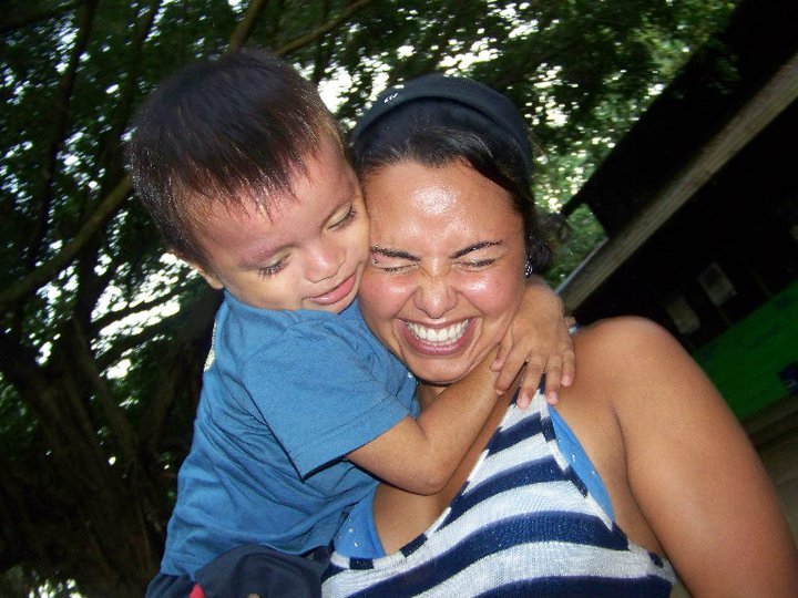 Karina being mauled by Felix, at Casa Guatemala. Rio Dulce, Guatemala -- April Beresford