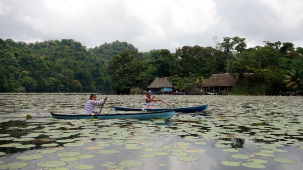 Mayan girls approach our lancha to sell crafts, Rio Dulce, Guatemala -- Karina Noriega