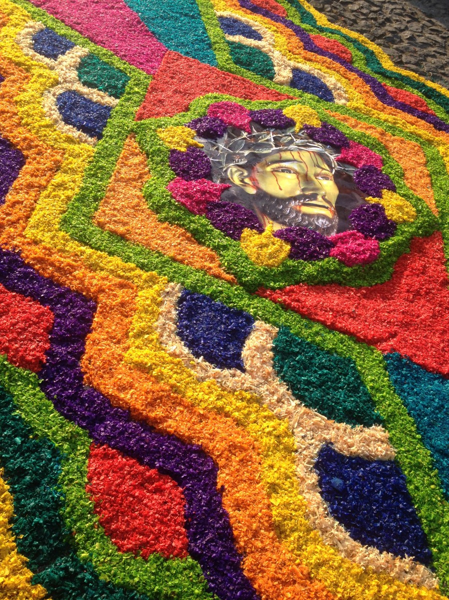 Flowered carpets known as alfombras adorn the streets of Antigua during one of the worlds most impressive religious festivals, Semana Santa. Antigua, Guatemala --April Beresford